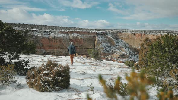 Taking photos in a canyon covered in snow. adventuring in nature and enjoying the weather.