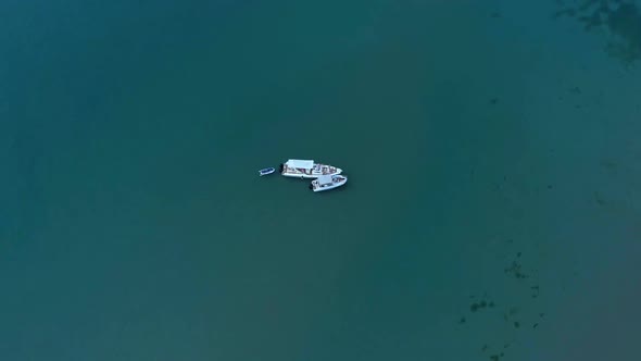 Anchored sailing boat in turquoise water