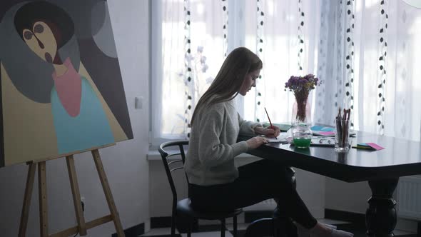 Stressed Unsatisfied Painter Crumpling Paper Throwing Away Picture Sitting Indoors