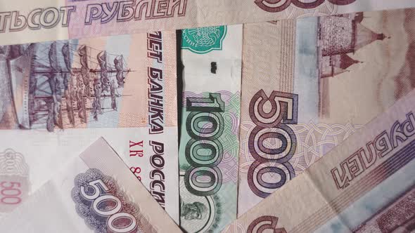 Russian money denomination m 1000 and 500 rubles rotate, top view