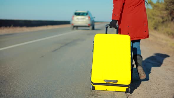 Walking With Yellow Travel Bag. Wife Left Her Husbands After Quarrel. Traveler Transportation.