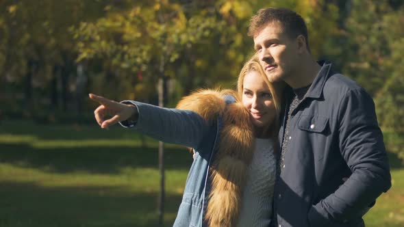 Girlfriend Pointing at Squirrel Running in Park, Romantic Date, Tender Relations