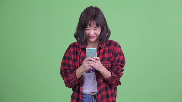 Happy Asian Hipster Woman Using Phone
