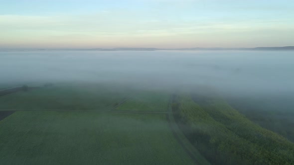 Aerial view of rural landscape with fog in autumn
