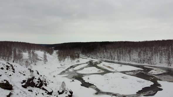 Winter Thaw on the River in the Mountains with the Approach of Spring