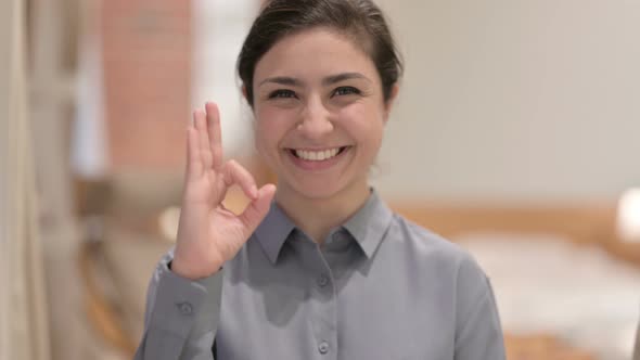 Portrait of Young Indian Woman showing Ok Sign