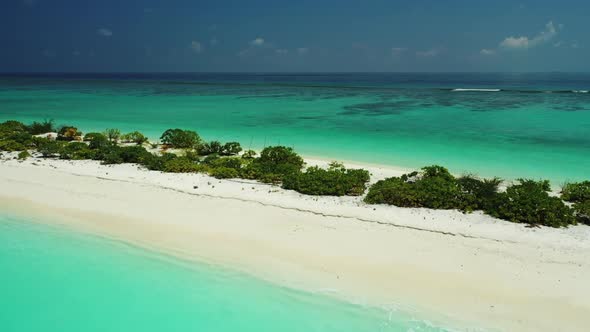 Aerial drone shot nature of idyllic bay beach adventure by turquoise sea with white sandy background