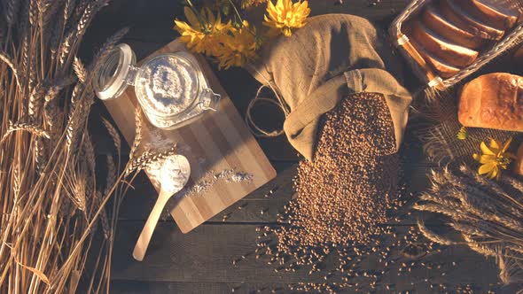 Still life with Bread, Wheat, Flour and Flowers.