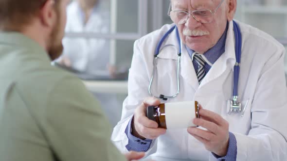 Senior Physician Telling about Medications to Patient