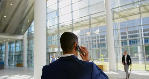 Caucasian businessman walking in the lobby at office 4k