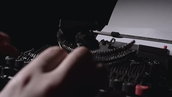 Poet Types the Text of the Poem on a Retro Typewriter