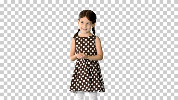 Cute little girl in polka dot dress clapping, Alpha Channel