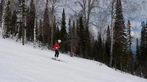 Happy Skier Skiing Down On Ski Slope In Mountain At Winter Resort In Motion