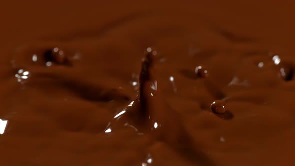 Super Slow Motion Detail Shot of Chocolate Liquid Drop at 1000 Fps