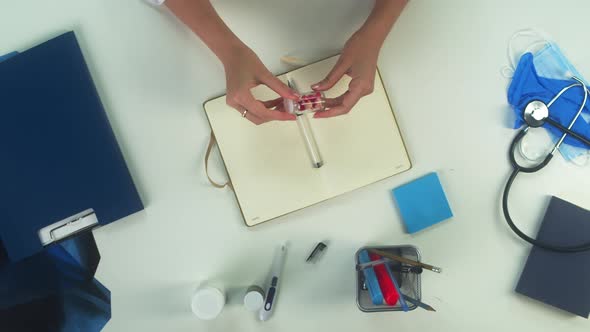 Woman Doctor Writing Pill Prescription Top View