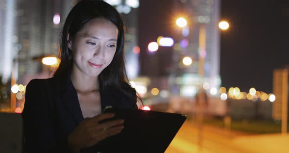 Business woman using tablet at outdoor street 