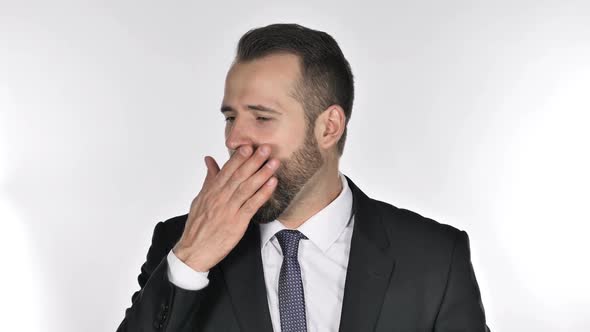 Tired Beard Businessman Yawning on White Background