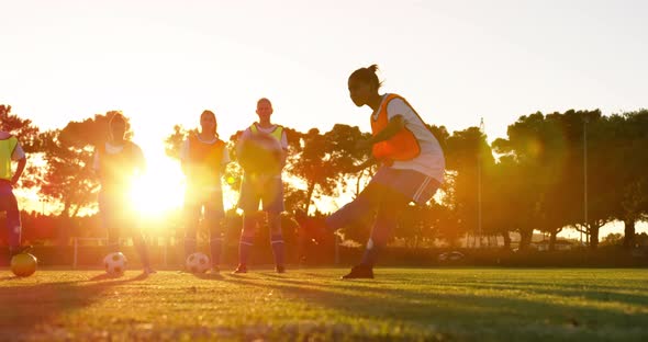 Female soccer player shooting the ball 4k