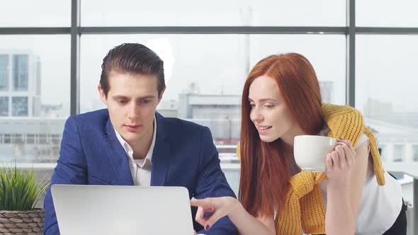 Young Businessmen Working on Laptop in Office