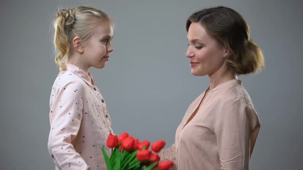 Daughter Giving Flowers to Mother, Women Day Congratulations, Surprise Gift