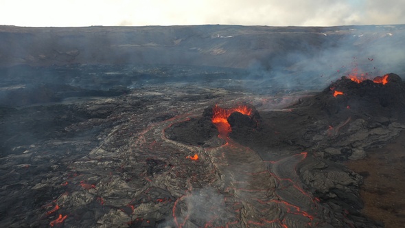 People standing close to active volcano aerial view, Mount Fagradalsfjall, Iceland