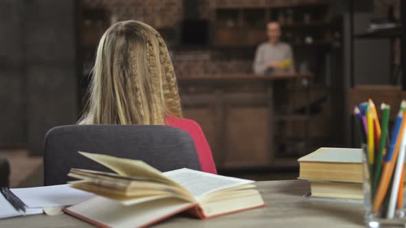 Smiling Teenage Girl Studying Lessons at Home