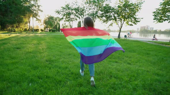 Woman Holding Rainbow Flag, Showing Tolerance.