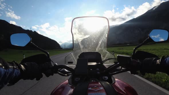 POV Biker Rides a Motorcycle on a Scenic Sunny Mountain Road Austria