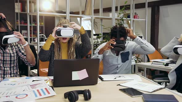 Creative International Workteam which Working in Virtual Reality Headset in Contemporary Office