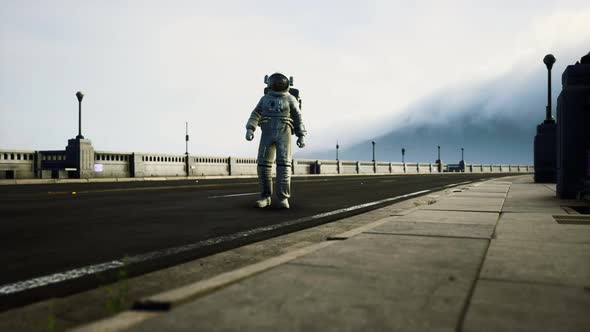 Astronaut in Space Suit on the Road Bridge