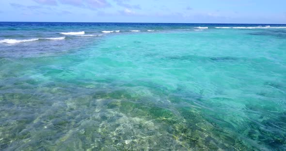 Beautiful drone island view of a sunshine white sandy paradise beach and blue sea background in 4K