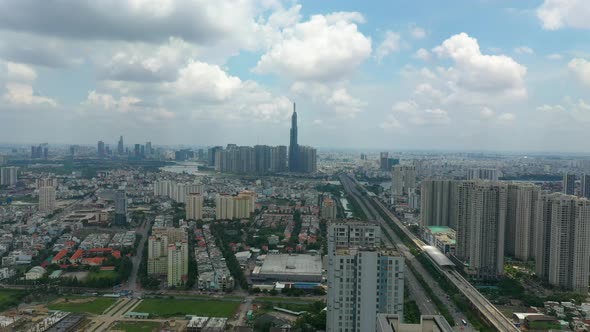 descending crane drone shot from epic city skyline, freeway and river landscape revealing luxury hig