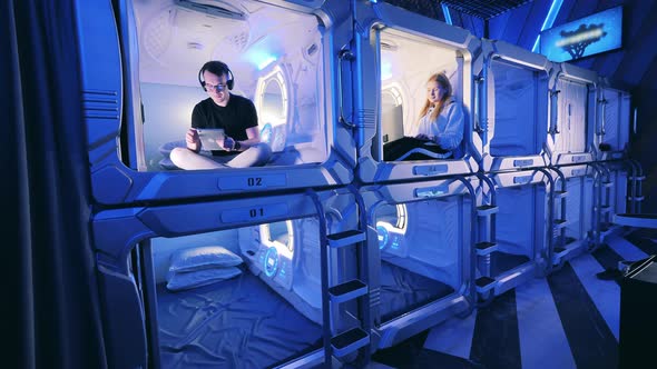 Young People are Resting in the Capsule Hotel Units