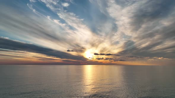 Cloudy sunset at sea aerial view 4 K