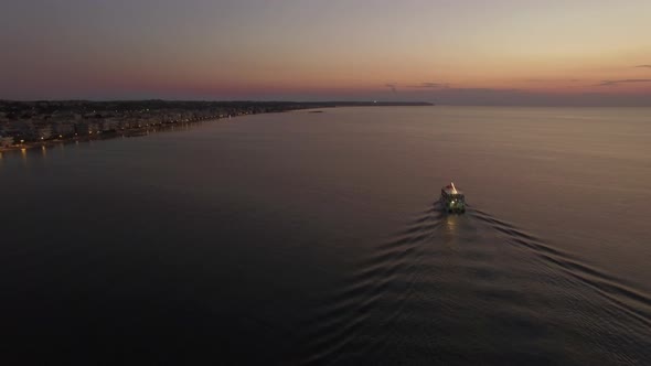 Aerial Flight Above the Sea and Coast Line on the Horizon in Greece