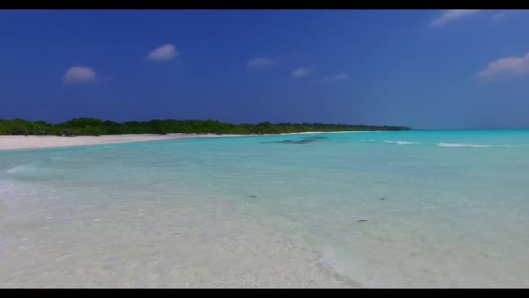 Aerial above scenery of paradise island beach break by turquoise water with white sandy background o