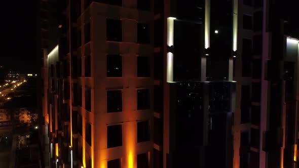 A modern building with beautiful colorful architectural illumination in night city 07