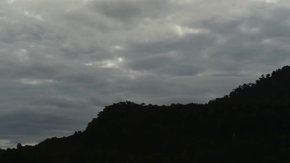 Time lapse of clouds moving over mountainside