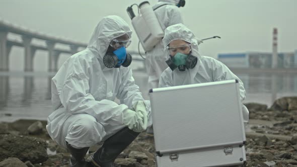 Team of Scientists Working on Polluted Coast