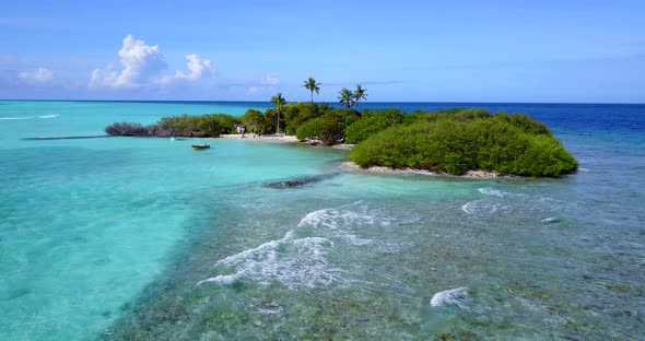 Wide drone clean view of a white sandy paradise beach and aqua blue ocean background in colorful 4K