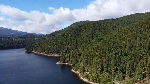 Lake Oasa And Forest, Aerial View, Romania