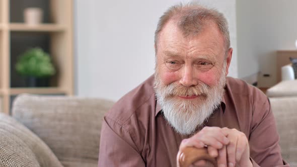 Closeup Wrinkled Face of Crying Disabled Grandfather Suffering Stress Depression at Retirement House