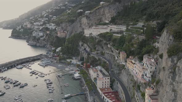 Aerial view of Amalfi, scenic city in mouth of deep ravine by Mediterranean sea, Italy. Authentic to