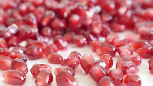 Grains of Punica granatum fruit shallow DOF 4K 3840X2160 UHD tilting video - Many red seeds of Lythr