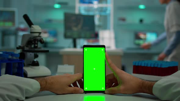 POV Shot of Chemist Using Smartphone with Green Screen
