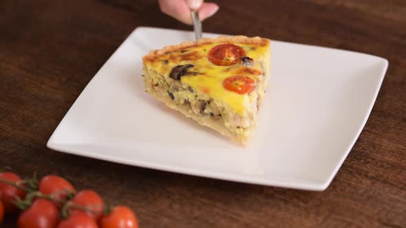 Chicken Quiche Lorraine with mushrooms, tomatoes and cheese.