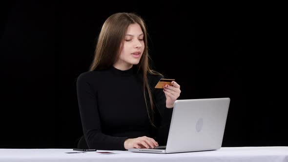 Girl Completes the Procedure of Online Shopping Payment. Black