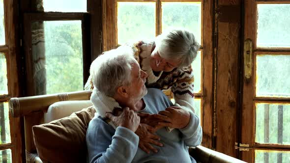 Couple of senior mature people enjoy time at home together hugging and loving. Portrait of elderly