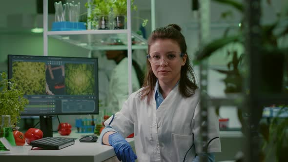 Portrait of Chemist Woman in White Coat Working in Pharmaceutical Laboratory