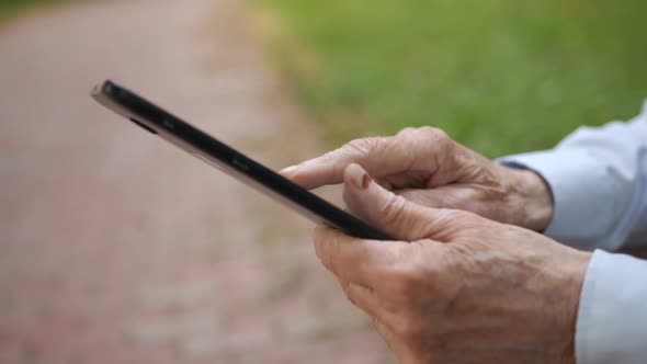 Senior Man Learns to Use a Tablet